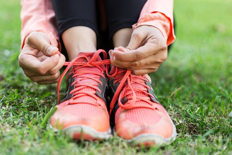 Girl Tying Running Shoes in the Sport Field Stock Photo Image of