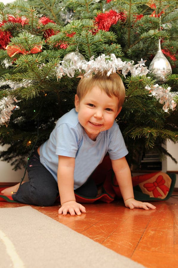 Girl Under Christmas Tree