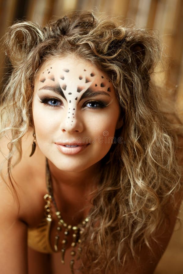 Girl with an unusual make-up as a leopard