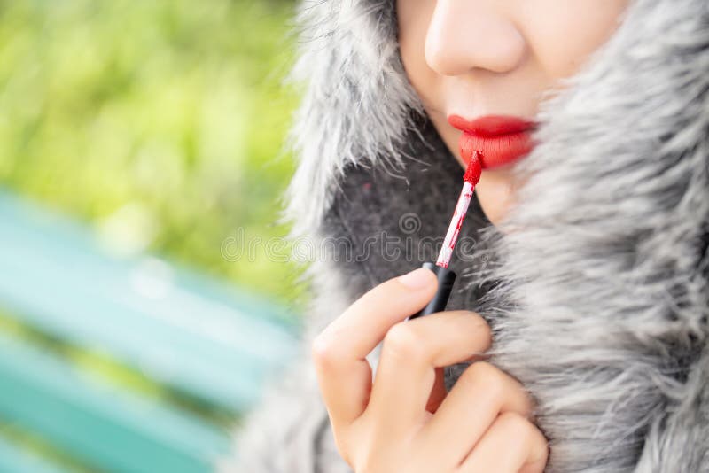 Girl use lipstick at the mouth. Fashion set sweet girl, Asian woman use lipstick. stock photos Girl use lipstick at the mouth. Fashion set sweet girl, Asian woman use lipstick. stock photos