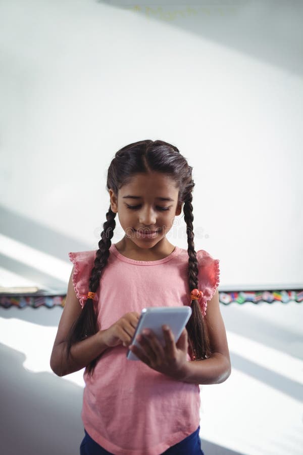 Girl using cellphone in school