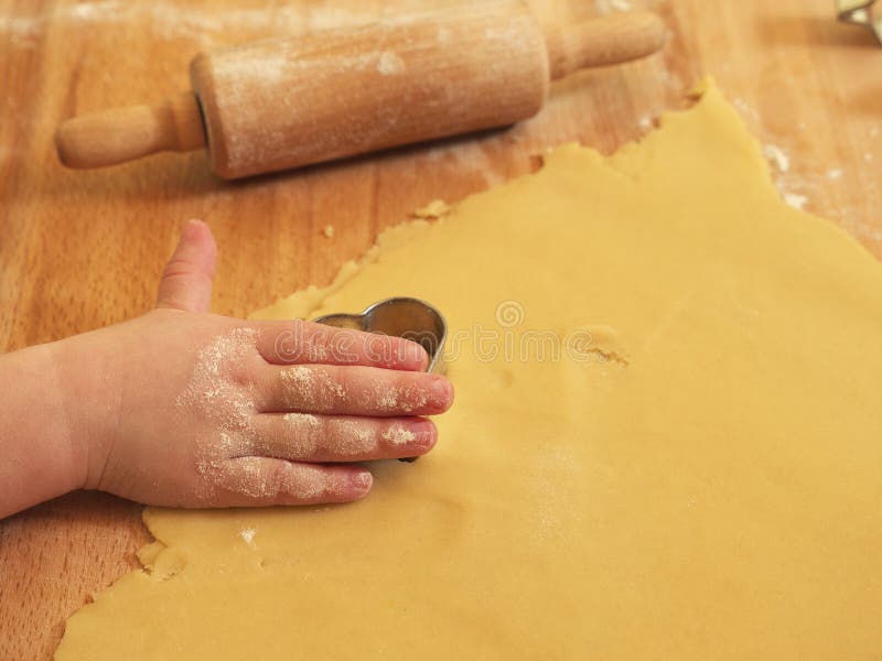 Girl using cookie cutter