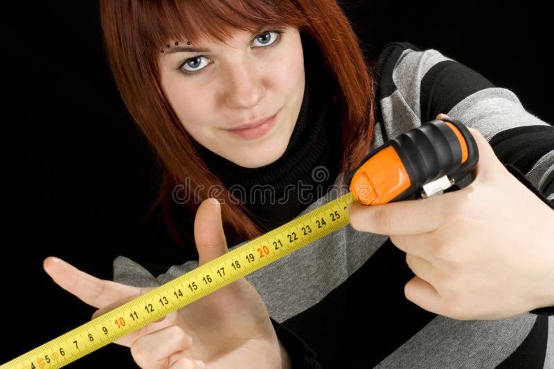 Girl using a measuring tape tool