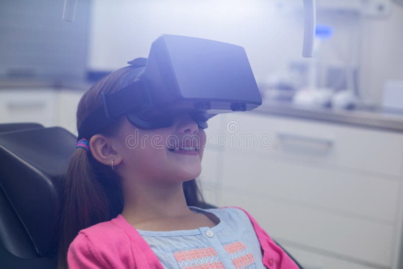 Girl Using Virtual Reality Headset during a Dental Visit Stock Image
