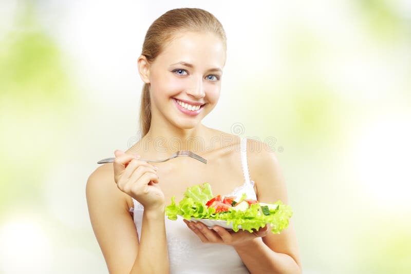 Girl with vegetable salad