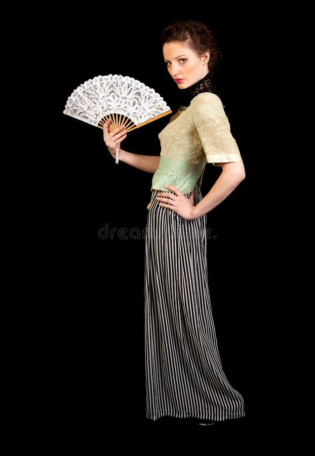 Girl in Victorian dress holding a fan