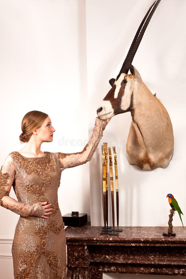 Girl in Vintage Dress with Stuffed Oryx and Bird Stock Image - Image of ...