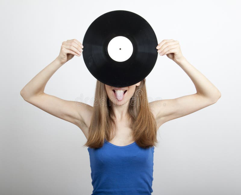 Girl with vinyl disc, on white