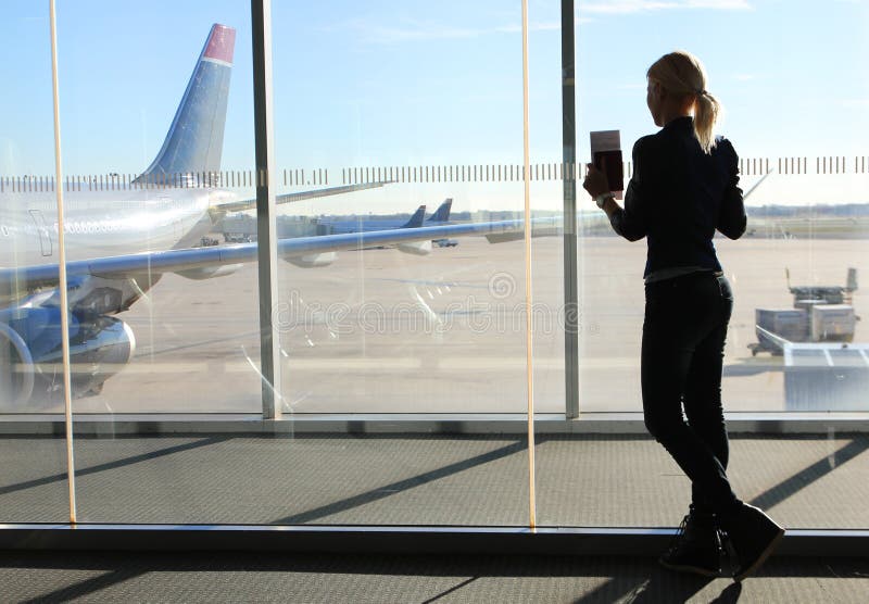Girl Waiting her Flight in Airport Terminal
