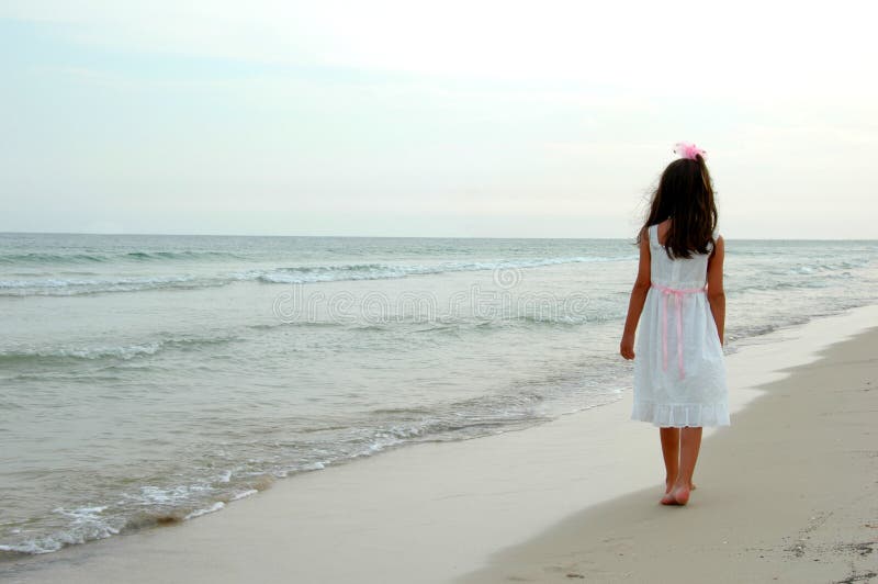 Girl Walking on Beach