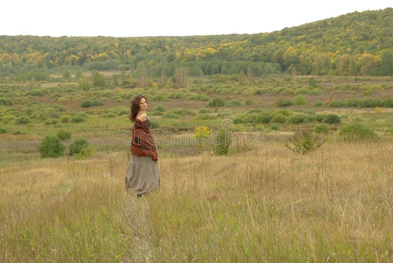 Girl walking in the field