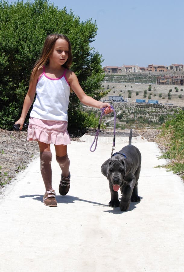Girl walking her dog