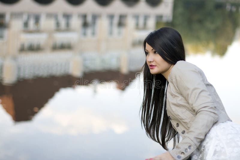 Girl walking near river