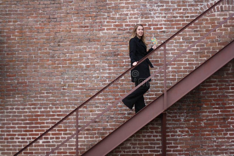 Girl walking up stairs stock image. Image of confident 16948461