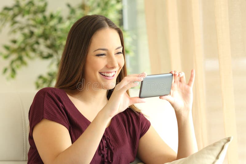 125 Girl Watching Videos Smart Phone Home Stock Photos
