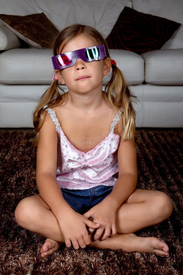 Girl wearing 3D glasses stock photos