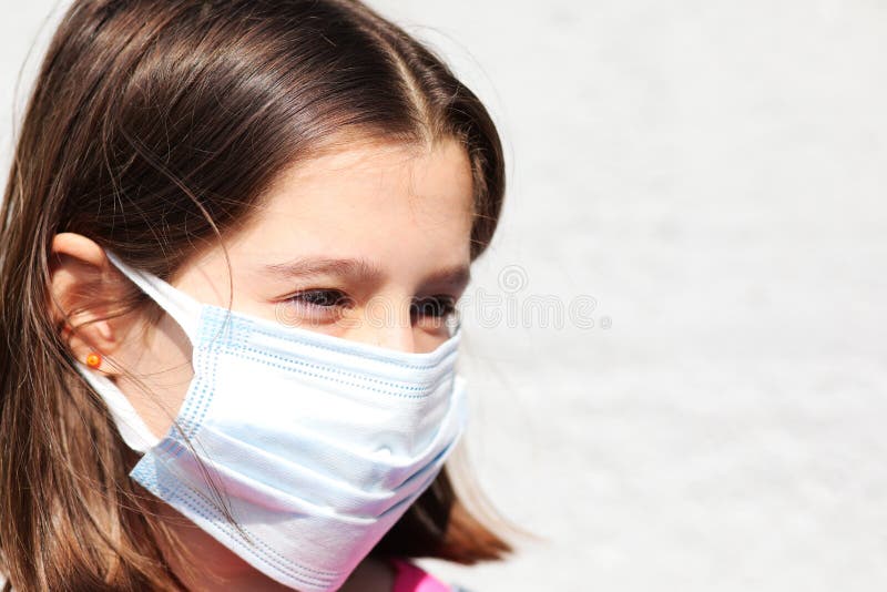 Girl Wearing a Disposable Surgical Mask To Protect Against Coron Stock ...