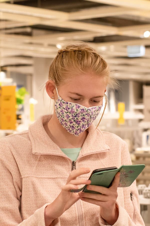 A girl wearing face mask in department store during COVID-19 pandemic. Mandatory face masks in NSW Australia