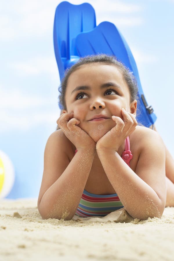752 Happy Little Girl Lying Sand Beach Stock Photos Free & Royalty