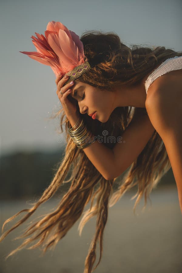 Girl wearing native indian headdress