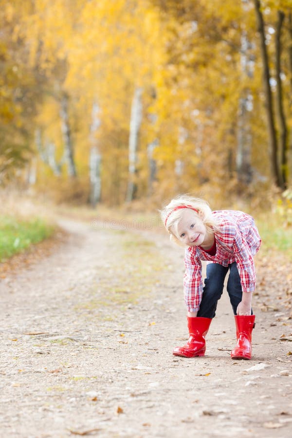 Girl wearing rubber boots stock image. Image of rubber 26732987