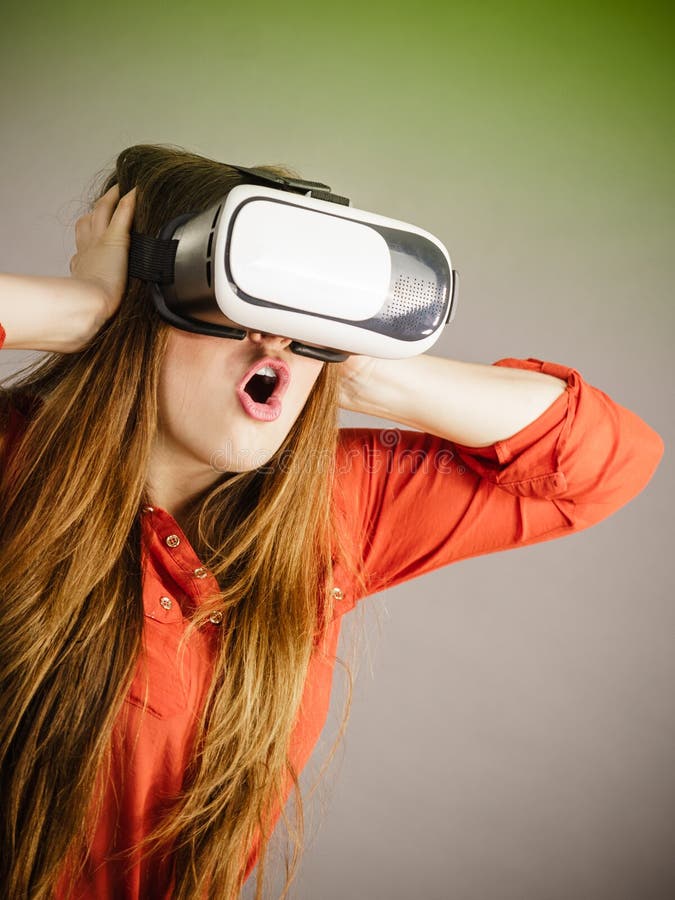 Young Woman In Her 30s Using Virtual Reality Goggles 