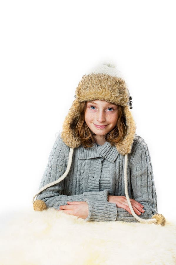 Girl wearing a winter hat royalty free stock photography