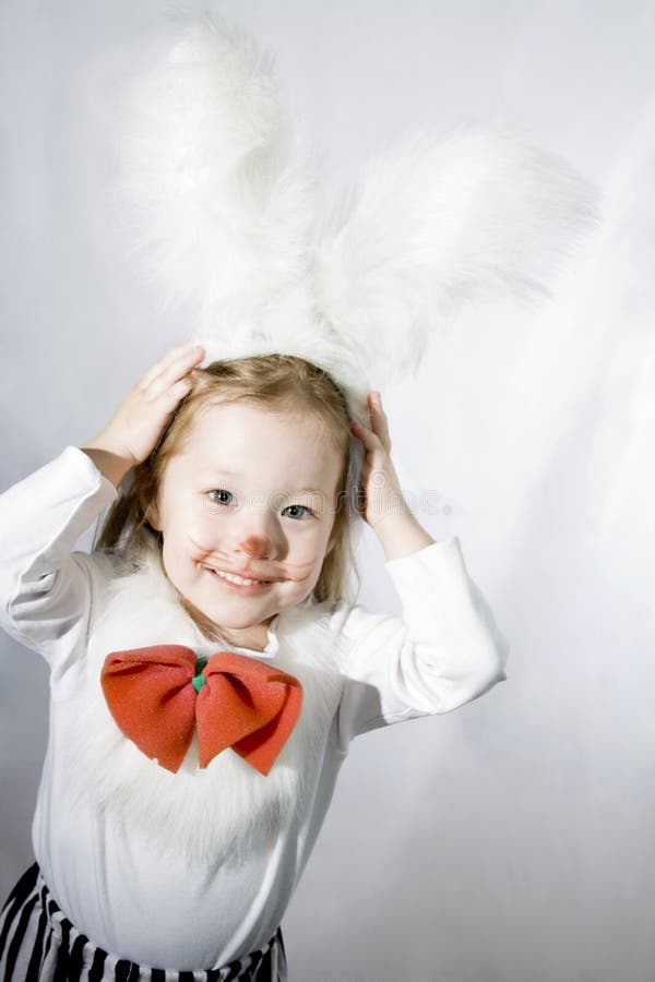 Girl in a white downy bunny costume.
