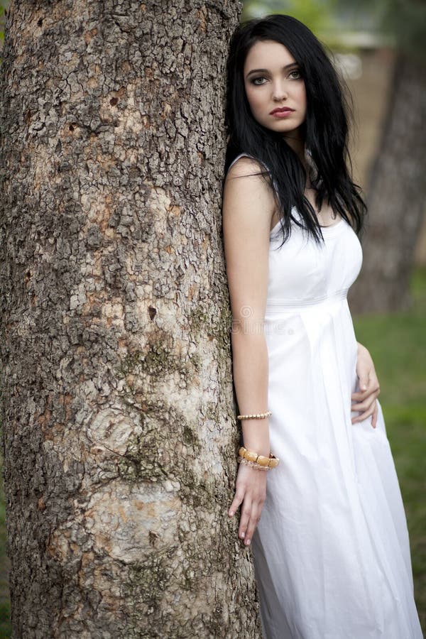 Girl in White Dress by Tree Stock Image - Image of black, glamour: 23139353 Girl in White Dress by Tree Stock Image - Image of black, glamour: 23139353