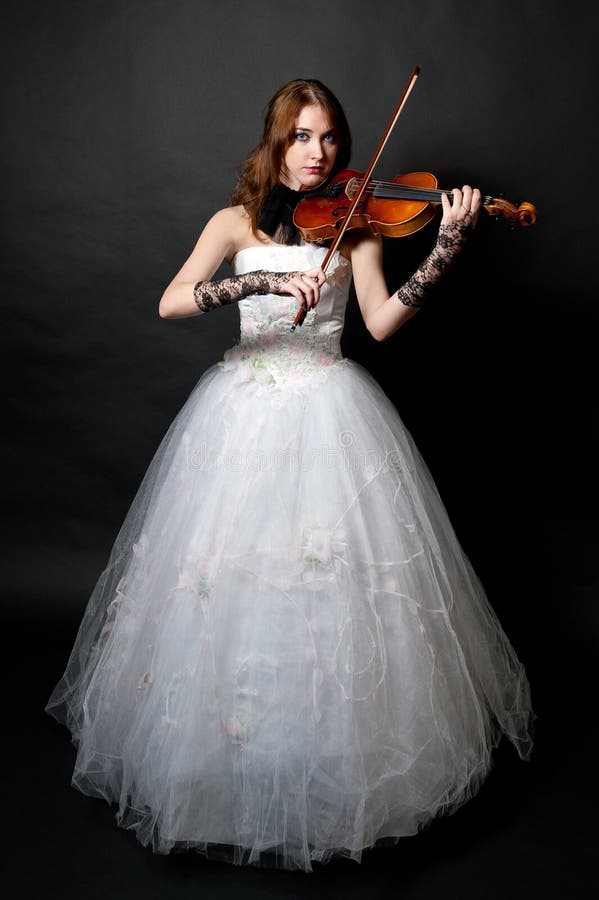 Girl in white dress with violin