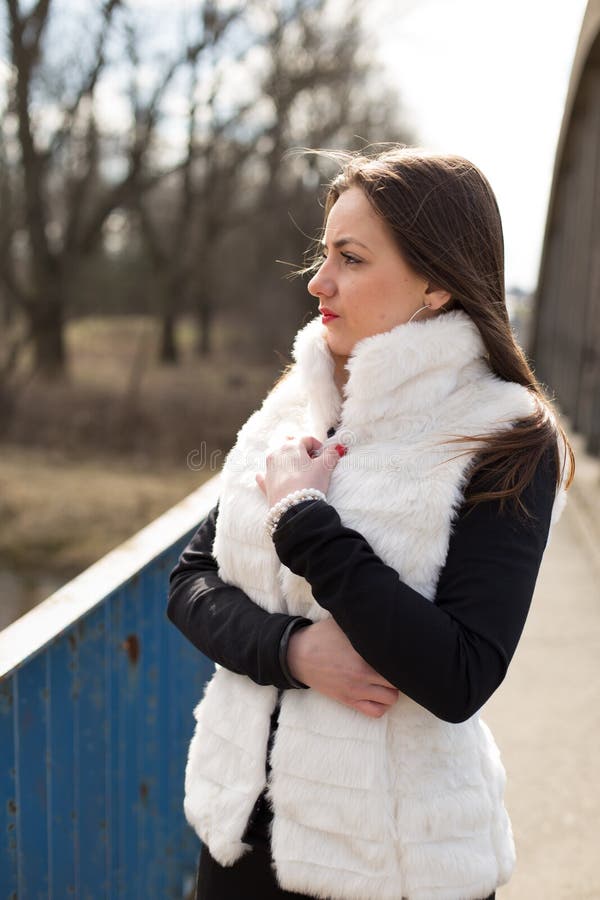 Girl in white fur coat stock photo. Image of shapely 51778892