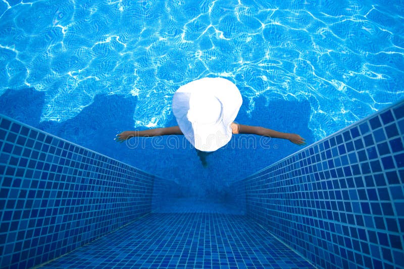 Girl, white hat and swimming pool