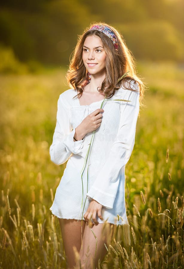 Girl with White Shirt on the Field at Sunset Stock Photo - Image of ...