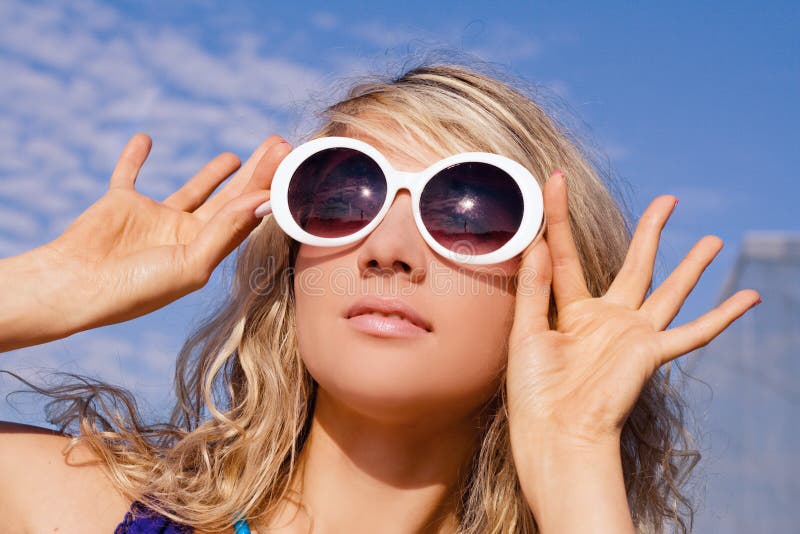 Girl in white sun glasses