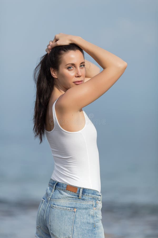 Girl In White Tank Top And Jeans Shorts Stock Image 