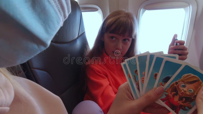 Girl And Woman Playing Cards