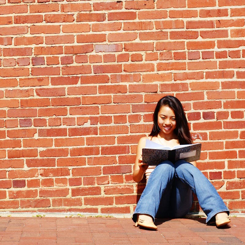 Girl Writing In Note Book