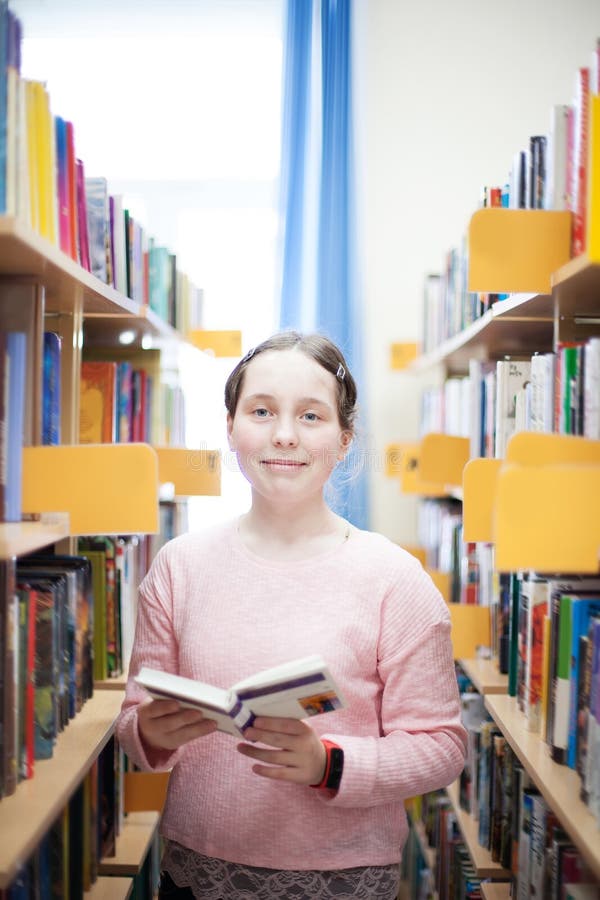 Girl of 13 Years Old Choosing Book in Library Stock Photo - Image of ...