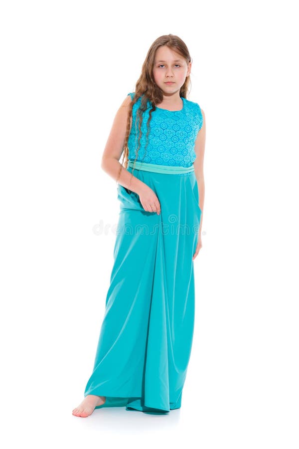 Girl 10-11 years old in a long emerald dress with bare feet. royalty free stock photos Girl 10-11 years old in a long emerald dress with bare feet. royalty free stock photos