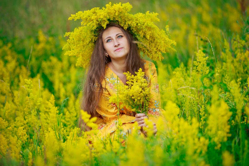 Girl with yellow flowers stock photo. Image of adult 73823546