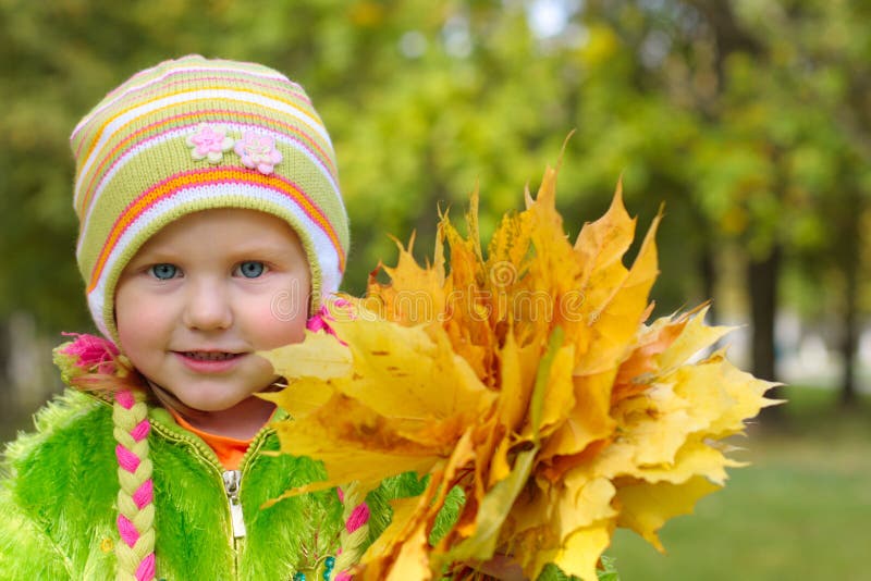 Girl with yellow leaves