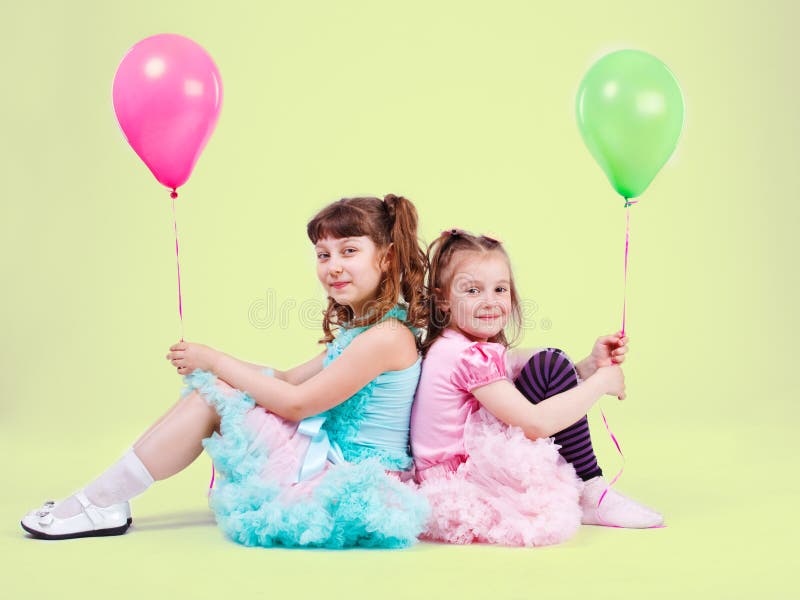 Girls with balloons stock photos