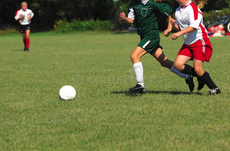 Girls Chasing A Soccer Ball