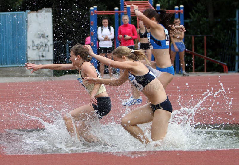 Girls Compete in the 3.000 Meter Steeplechase Editorial