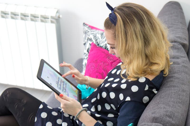 Girls on the couch stock image. Image of communications 36655375
