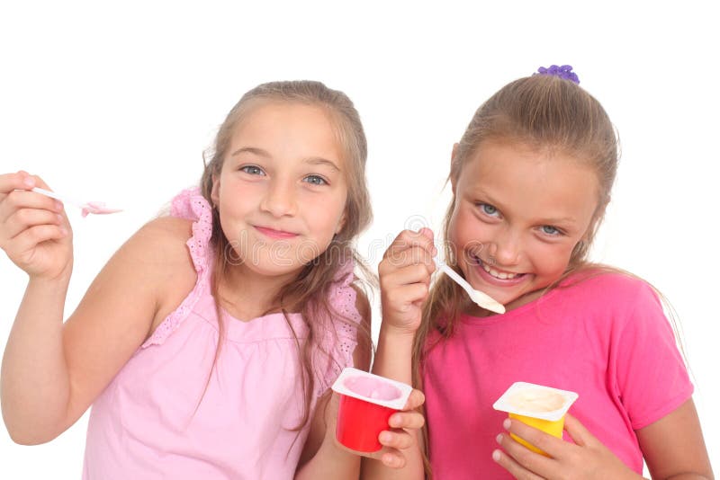 Girls eating yogurt stock photo. Image of child, smile 49700808