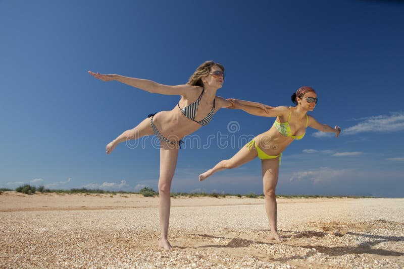 Girls exercising on a beach