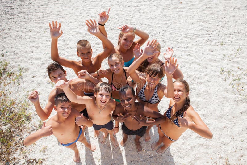 Girls and guys on sand on summer vacation royalty free stock image Girls and guys on sand on summer vacation royalty free stock image