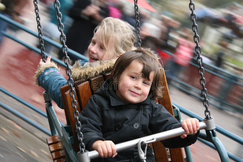 Girls having fun on the Carousel royalty free stock photo