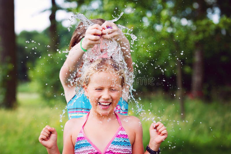 Pech Peer Tranen Girls Having Fun Outdoor with Water Balloons Stock Image - Image of nature,  colorful: 25527781